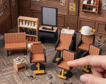 May include: A collection of miniature 3D printed barber shop furniture including chairs, a styling station with a mirror, a sink, a bench, and shelving units. The text reads DIGITAL STL FILES - NO PHYSICAL ITEM and INSTANT DOWNLOAD.