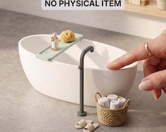 May include: A miniature white oval bathtub with a sage green tray holding a small bottle and sponge, a dark gray floor-standing faucet, a woven basket with four white towels, and beige slippers. Text reads: DIGITAL STL FILES NO PHYSICAL ITEM.