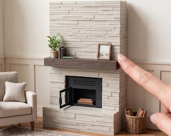 May include: A miniature fireplace model with a light beige stacked stone facade and a dark brown wood-grain mantel. The unit features a black firebox with an open door, a small potted plant, and a picture frame. Text reads: DIGITAL STL FILES - NO PHYSICAL ITEM. INSTANT DOWNLOAD.