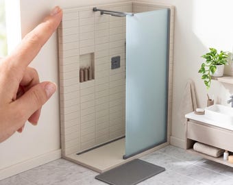 May include: A miniature shower stall model featuring beige subway-style wall tiles, a frosted glass panel, a dark gray shower head, and a recessed shelf with three small bottles. Text reads: DIGITAL STL FILES - NO PHYSICAL ITEM.