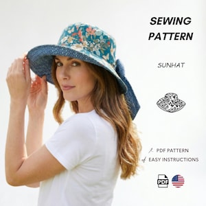 May include: A sewing pattern for a sunhat featuring a teal fabric with a floral and butterfly print on the crown and a dark blue patterned fabric on the underside of the brim. The text reads SEWING PATTERN, SUNHAT, PDF PATTERN, EASY INSTRUCTIONS.
