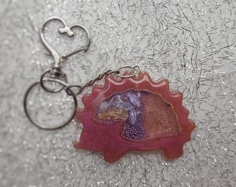 Hedgehog shaped, pink shimmer,  dry rattle shaker keychain with heart clip.