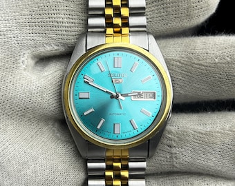 Orologio automatico Seiko – Quadrante turchese, bracciale bicolore oro e argento, datario (giorno e data)