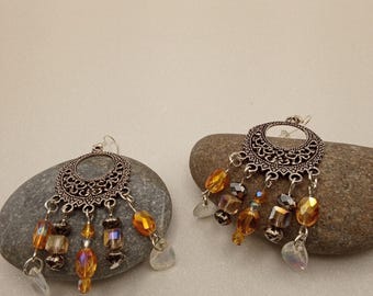 Antique silver chandelier earrings with peach glass dangles.