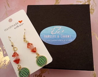 Gold enamel watermelon czek glass dangles earrings, with flowerand watermelon charms.
