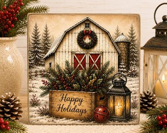 May include: A square wooden sign featuring a winter scene with a white barn, a silo, and snow-covered pine trees. A wooden crate in the foreground holds greenery and berries, with the text "Happy Holidays" printed on it, next to a lantern.