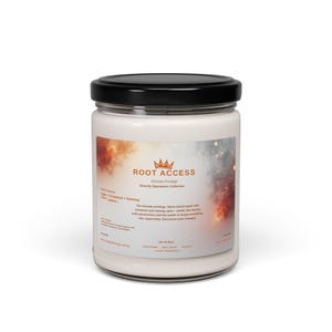 May include: A white glass jar candle with a black lid. The label reads "ROOT ACCESS" with the tagline "Ultimate Privilege Security Operations Collection." The scent is apple, cinnamon, and nutmeg. The candle is hand-poured and has a 50+ hour burn time.