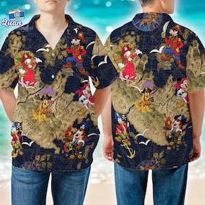 May include: Navy blue button-down shirt featuring a pirate map design with cartoon characters. The shirt has short sleeves and a classic collar. The map design includes Mickey Mouse, Donald Duck, and Goofy in pirate attire.