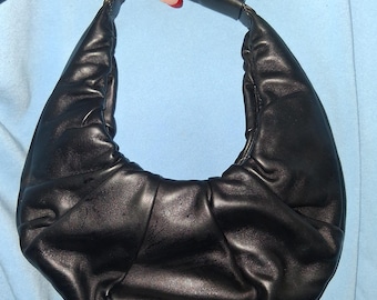 Staud Black leather bag with a boho touch