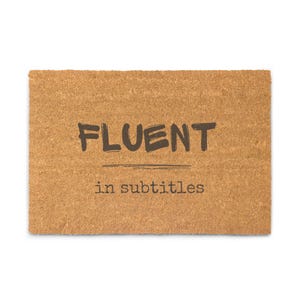 May include: A rustic wooden sign with the text "Welcome to our home" in a handwritten style. The sign features a distressed finish and a simple, inviting design, perfect for a front porch or entryway.