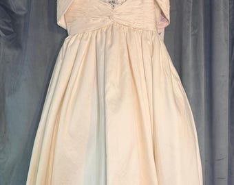 Vestido de comunión de seda de la colección Sweetie Pie con chaqueta a juego.