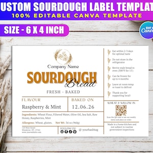 Puede incluir: Una plantilla de etiqueta de pan de masa madre personalizada, 15.24 x 10.16 cm, con funciones editables de Canva. La etiqueta presenta "SOURDOUGH Bread" con sabor a "Raspberry & Mint", horneado el 12.06.26. Incluye ingredientes, peso neto e instrucciones.