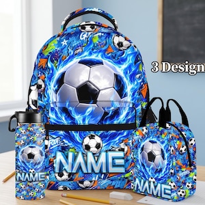 May include: A blue backpack, lunch bag, and water bottle set featuring a soccer ball graphic surrounded by blue flames and graffiti-style patterns. Each item includes the word NAME in bold, silver-toned lettering on the front.