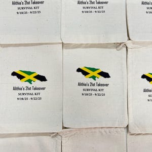 May include: Multiple off-white fabric bags, each printed with a Jamaican flag design and text. The design includes a black silhouette of Jamaica, a yellow cross, green stripes, and the text "Alithia's 21st Takeover SURVIVAL KIT 9/18/25 - 9/22/25."
