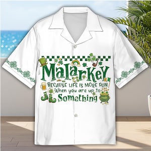 May include: White button-down shirt with a green and black design featuring the word "Malarkey" and St. Patrick's Day themed graphics. The shirt includes a collar and short sleeves, perfect for a casual look.