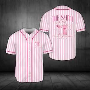 May include: A short-sleeved button-down baseball jersey with vertical pink and white stripes. The front features a small cocktail graphic and text. The back displays a large graphic with two cocktails, the text THE SMITH CLUB, EST. 2026, and Olivia's Bachelorette CHARLESTON, SC.