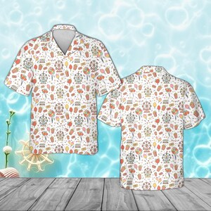 May include: White button-up shirt with a carnival-themed pattern. The design includes Ferris wheels, popcorn, balloons, and other carnival elements in a repeating pattern. The shirt has short sleeves and a classic collar.