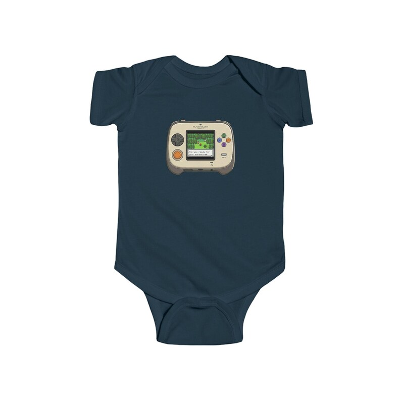 May include: Navy blue baby bodysuit featuring a retro handheld video game graphic. The game console is beige with a green screen displaying a pixelated landscape. It has orange and colorful buttons. A cute and playful design for a baby.