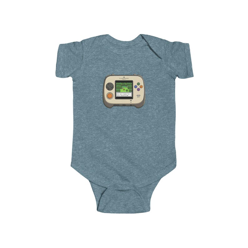 May include: A blue baby bodysuit featuring a retro handheld video game graphic. The game console is beige with a green screen displaying a pixelated landscape. It has orange and purple buttons. A fun and nostalgic design for a baby.