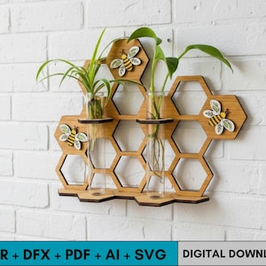 May include: Wooden honeycomb-shaped wall planter with three glass vases holding green plants. Decorative wooden bees are attached to the honeycomb. The planter is mounted on a white brick wall. Text at the bottom reads "CDR + DFX + PDF + AI + SVG DIGITAL DOWNLOAD".