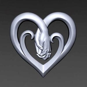 May include: A silver-colored heart-shaped sculpture. Two hands are clasped together in the center of the heart. The heart has a smooth, curved design with a pointed bottom. The background is a solid gray color.