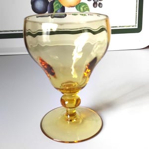 English hand-blown amber wine glass by Webb