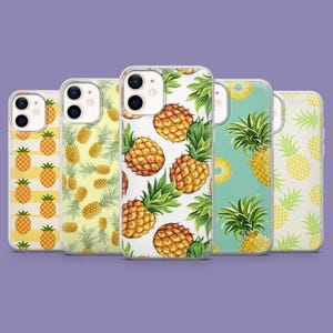 May include: Five phone cases with pineapple patterns. Designs include yellow stripes, scattered pineapples, and watercolour illustrations of the fruit with green leaves. The cases are clear, set against a purple background.