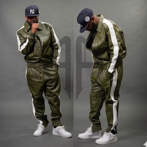 May include: A set of three ceramic mugs with a speckled, matte finish. The mugs are in shades of cream, light brown, and dark brown. Each mug has a simple, minimalist design and a rounded handle.