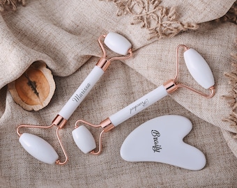 Personalized massager set, including gua sha board and rollers, body and face massagers.