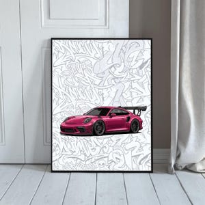 May include: Framed print of a magenta sports car illustration. The car is set against a white background covered in grey graffiti art. The print is displayed on a white wooden floor, leaning against a white door.