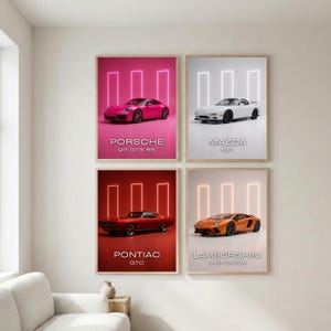May include: Four framed car posters. The top left poster features a pink Porsche 911 GT3 RS. The top right poster features a white Mazda RX7. The bottom left poster features a red Pontiac GTO. The bottom right poster features an orange Lamborghini Aventador.