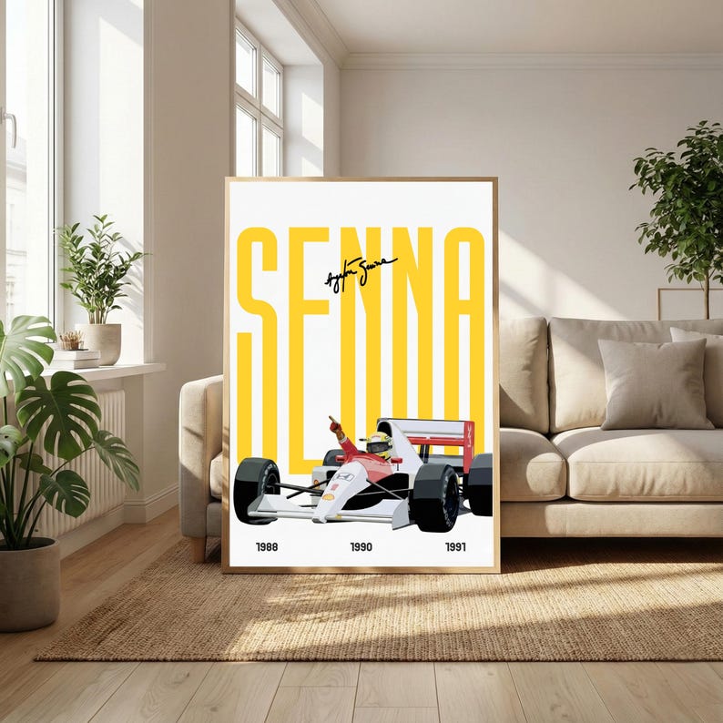 May include: Framed poster featuring a Formula 1 race car in red, white, and black, with the name "SENNA" in large yellow letters. The years 1988, 1990, and 1991 are printed at the bottom. The poster is displayed in a living room.
