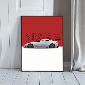 Op de afbeelding: Ingelijste kunstdruk met een witte Nissan sportwagen met een zwarte spoiler, tegen een rode en witte achtergrond. Het woord "NISSAN" wordt in zwarte blokletters boven de auto weergegeven.