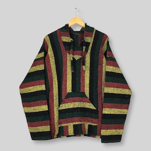 May include: A Baja-style striped hoodie with vertical stripes in red, yellow, green, and black. The pullover has a front pocket and a hood with a drawstring. The garment is suspended from a wooden hanger.