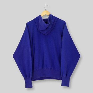 May include: A royal blue hoodie with a hood and long sleeves. The hoodie is hanging on a wooden hanger. The cuffs and waistband are ribbed.