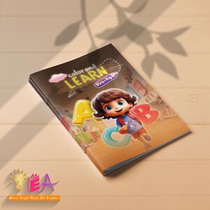May include: A stack of children's activity books with the title "Color and Learn" and "Pre-Kg" on the cover. The cover features a cartoon child holding large ABC letters. The background is a light wood grain.