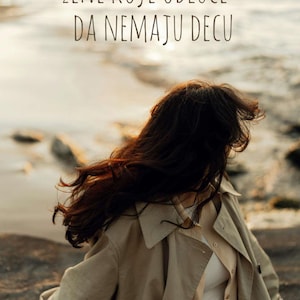 May include: A woman with long, dark hair wearing a beige trench coat, facing away from the camera. The text in the image reads "ŽENE KOJE ODLUČE - DA NEMAJU DECU". The background is a blurred view of a body of water.