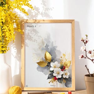 May include: Wooden framed art print featuring a watercolor floral design with white flowers, gold leaves, and red berries. The print includes the text "March 4" and "Raspberry Lane". A vase of yellow flowers and other decorative items are in the foreground.