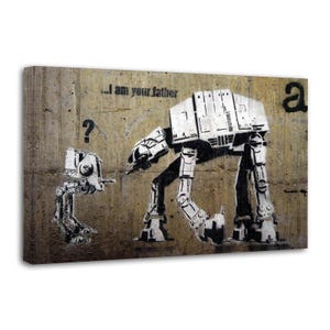 May include: A canvas print featuring a black and white stencil art design of two AT-AT walkers from Star Wars. The larger walker has the text "...I am your father" above it. A question mark is next to the smaller walker.