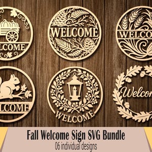 May include: A collection of six laser-cut wooden welcome signs with fall-themed designs. Each sign is circular and features intricate details like pumpkins in a wagon, a squirrel, and autumn leaves. The word "Welcome" is prominently displayed on each sign.