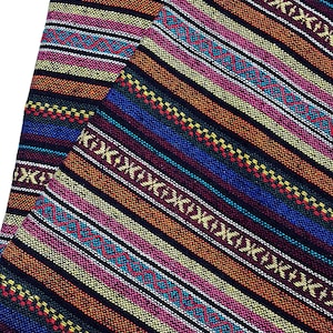 May include: Multicolored striped fabric with a geometric pattern. The fabric is woven with a variety of colors, including red, orange, yellow, green, blue, and purple.