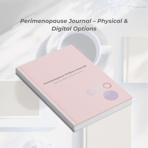 May include: A pink journal titled "Perimenopause Wellness Journal" with the text "Track Your Body, Mind & Emotions." The cover features geometric designs. The image also shows a coffee cup and other books.