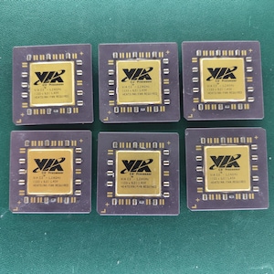May include: Six square VIA C3 processors arranged in two rows of three. Each dark brown CPU features a central gold-colored square plate with black text reading VIA C3 Processor, 1.2GHz, 133 x 9.0, 1.45V, and HEATSINK/FAN REQUIRED.