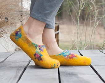 Felted yellow spring slippers made from bright sheep wool decorated with unique felting technique