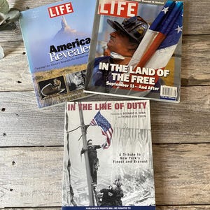 May include: Three LIFE magazine covers. One cover reads "America Revealed" with an image of a mountain. Another cover reads "In the Land of the Free" with a firefighter and the American flag. The third cover reads "In the Line of Duty".