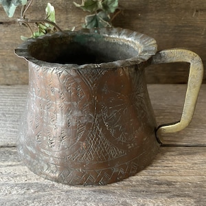 May include: A set of three ceramic vases in varying heights. The vases are white with a textured, ribbed design. The tallest vase is approximately 10 inches tall, the medium vase is 8 inches, and the smallest is 6 inches.