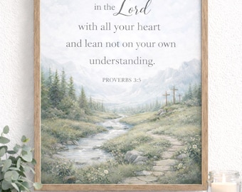 May include: Framed art print with a landscape scene featuring a river, trees, and three crosses. The text "Trust in the Lord with all your heart and lean not on your own understanding. Proverbs 3:5" is displayed in elegant script.