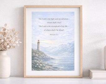 May include: Framed art print featuring a lighthouse on a rocky coast, with a serene ocean and mountain backdrop. The artwork is in soft blue and white tones, with text from Psalm 27:1. The print is displayed in a light wood frame.