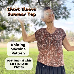 May include: A woman wearing a brown and white knitted short-sleeve summer top. The image includes text that reads "Short Sleeve Summer Top", "Knitting Machine Pattern", and "PDF Tutorial with Step-by-Step Photos". The background is a sunny outdoor scene.