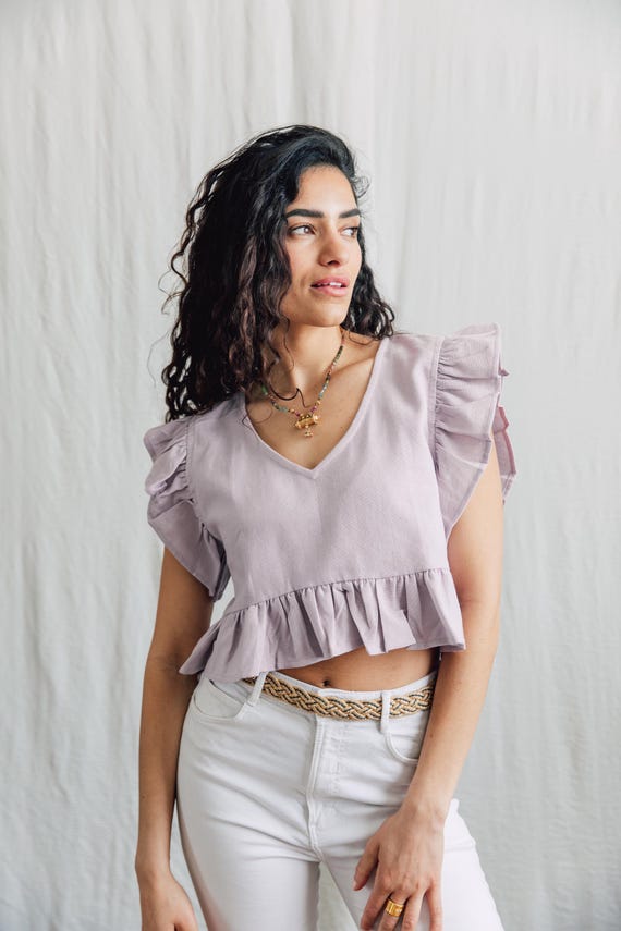 Raw cotton Lilly Top with delicate ruffle detail.